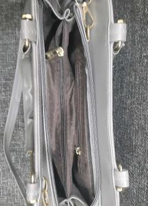 Grey Handbag with Gold Accents
