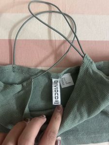 green tank top