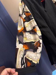 Unique Black Blouse with Patterned Sleeves