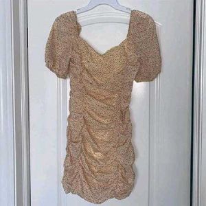 nude floral ruched mini dress with puff sleeves