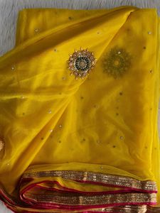 Elegant Yellow Saree with Pearl Details