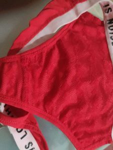 Red &#34;Love is Noise&#34; Thong