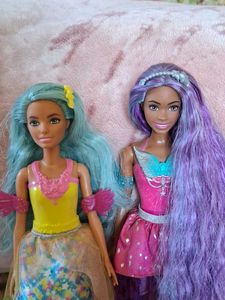 Two touch of magic Barbie dolls
