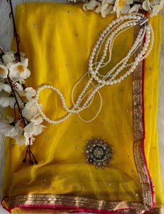 Elegant Yellow Saree with Pearl Details