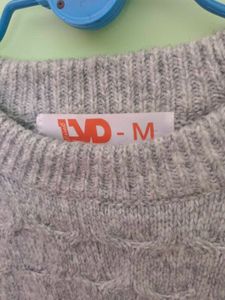 girls woolen sweater of white colour