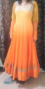 A very pretty orange and yellow double shaded full flayar anarkali with chudidar and pretty orange dupatta