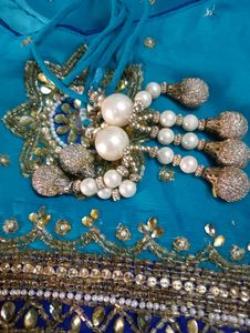 party wear saree firozi colour saree &amp; dark blue border with beautifu work as per showing in pic full length saree blouse size mention in pic