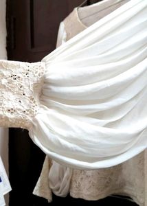 white top with heavy balloon sleeves