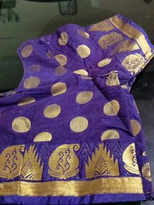 ElegantBrownFancy Pattu Sareewith blue border.