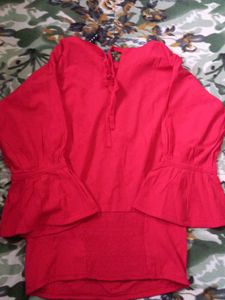 A Red Top With Some Black Details