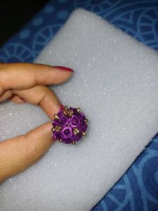 Vibrant purple rose cluster ring with golden Stone