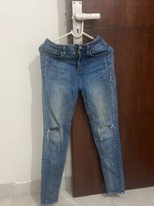 Ripped Knee Denim Jeans