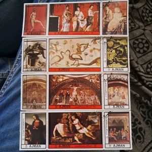 12 Vintage AJMAN painting stamps.