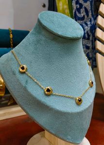 Gold Chain Necklace Featuring black bead or onyx