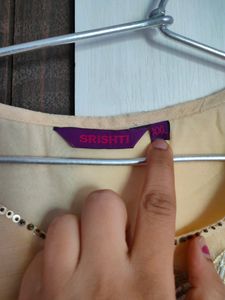 Srishti Peachy Golden Gown