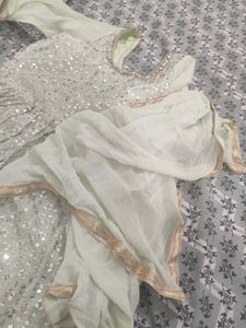 A Light green Sharara suit