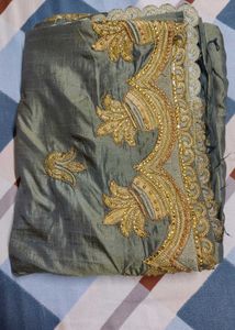 Elegant Green Silk Saree with Heavy Golden Embroid