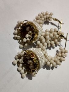 A Plastic Work Jhumka With Whitish Colour