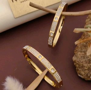 Gold Tone Flower Bangle Set