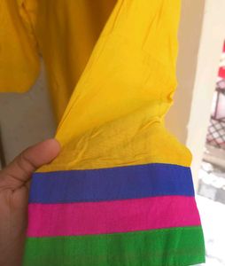 Yellow Kurti With Multicolor Embroidered Yoke