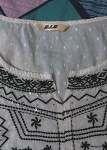 Pure Cotton, White Kurti From The Brand DJ&amp; C.It Has Black Thread Work With Silver Sequins Work.