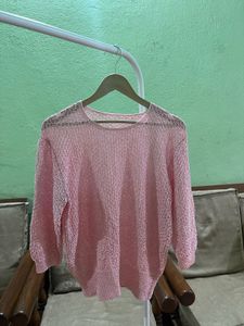 pink open-knit sweater