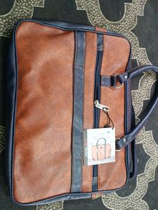 Brown and Navy Leather Travel Bag