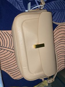 classy beige slingbad/handbag with two belts