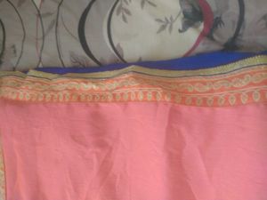 a new coral colour  chiffon saari without blouse