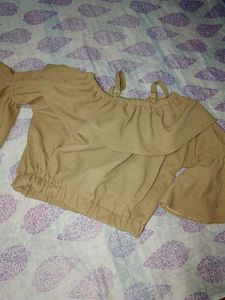 Ruffled embellished tan blouse