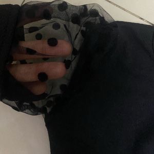 Chic Black Dress with Polka Dot Sleeves