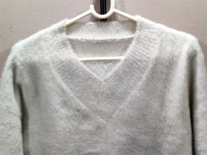 premium imported white V-neck mohair sweater.