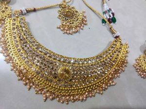 Golden Colour Choker With Earring Pair And Tika