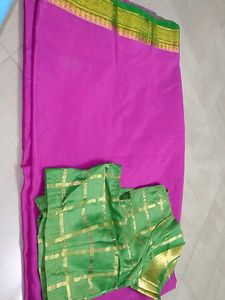 Pink & green saree with stiched blouse.