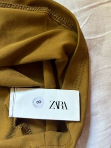 Zara asymmetric polyamide top.