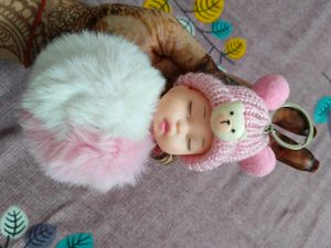 combo of cute doll keychain , bracel