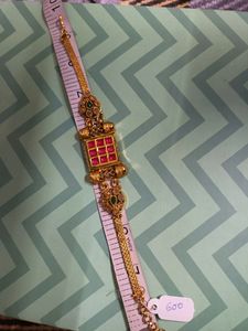 Gold Tone Bracelet with Red and Green Stones