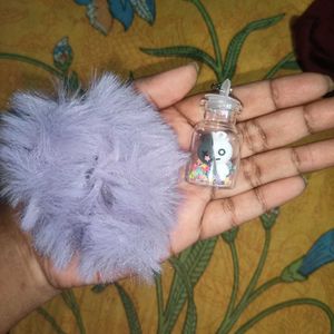 An Army Keychain With Purple Scrunchies