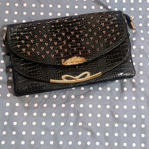 Black Clutch with Gold Accents