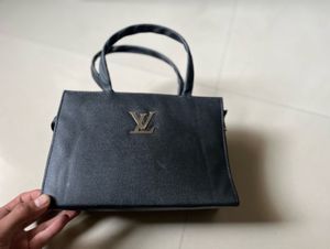 Chic Black Handbag with Logo Detail