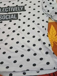 A Grey Top With Polka Dots