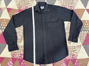 Combo of black shirt and blue straightfit jeans