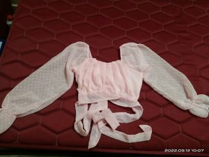 Beautiful pink color top. Small in size.