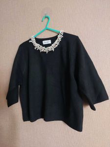 Elegant Black Top with Pearl Detail