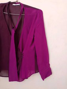 Branded two- tone wrap top.