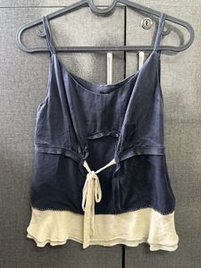 A Navy Blue & Cream Coloured Tank Top.