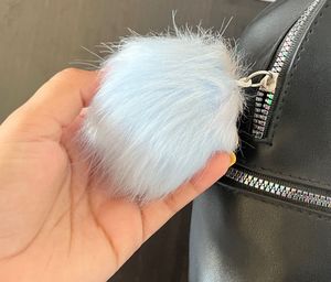 Black Mini Backpack with Pom Po