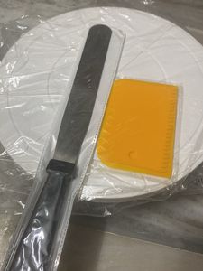 Rotating Table With Spatula For Cake Making A