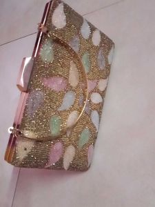 get this  embroidered branded cluch @499