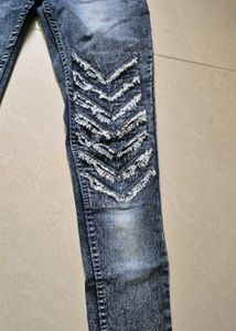 Trendy Distressed Denim Jeans with Chevron Design
